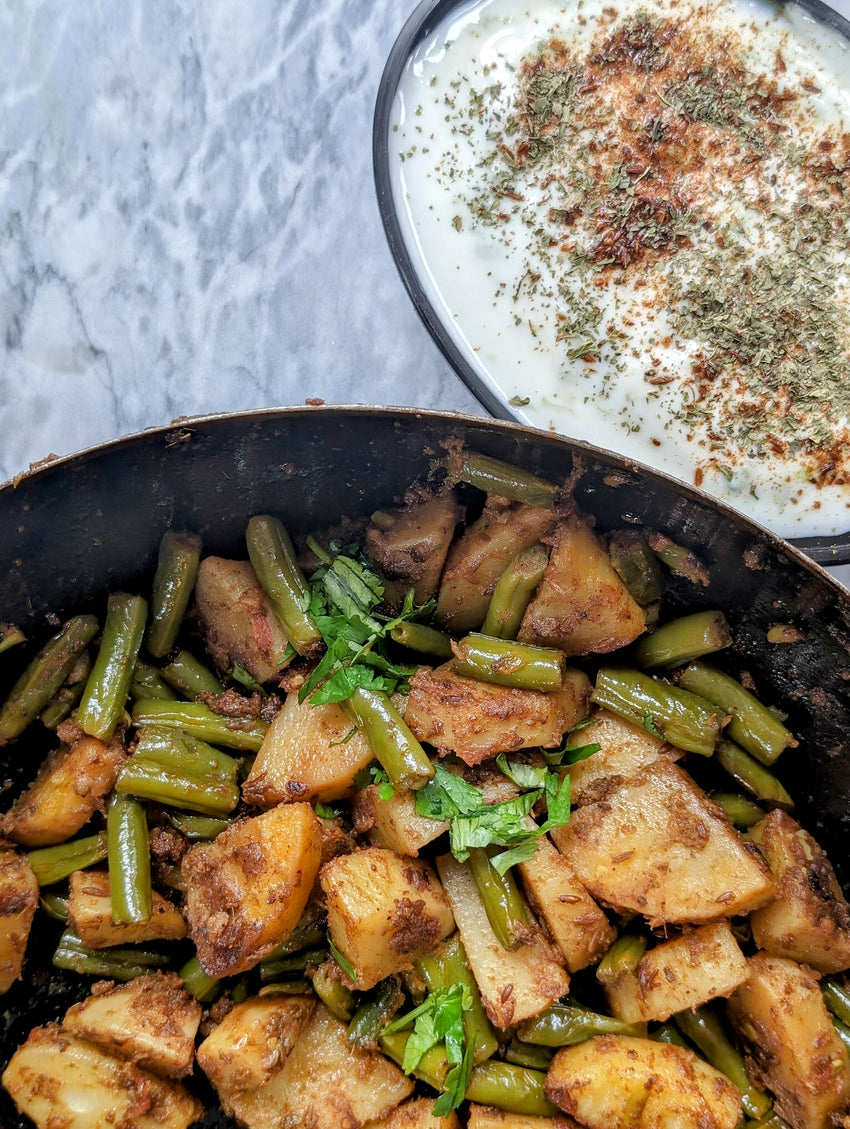 Beans Aloo subzi with cucumber raita, a deliciously simple meal taught by DHOL SPICE MIX