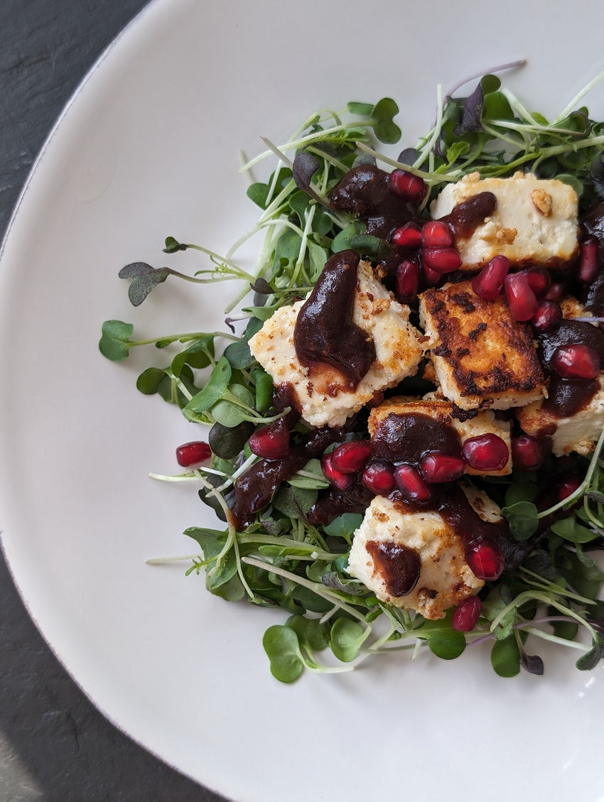 Grilled paneer cubes over a bed of fresh microgreens drizzled with a chutney made by DHOL Spice Mix