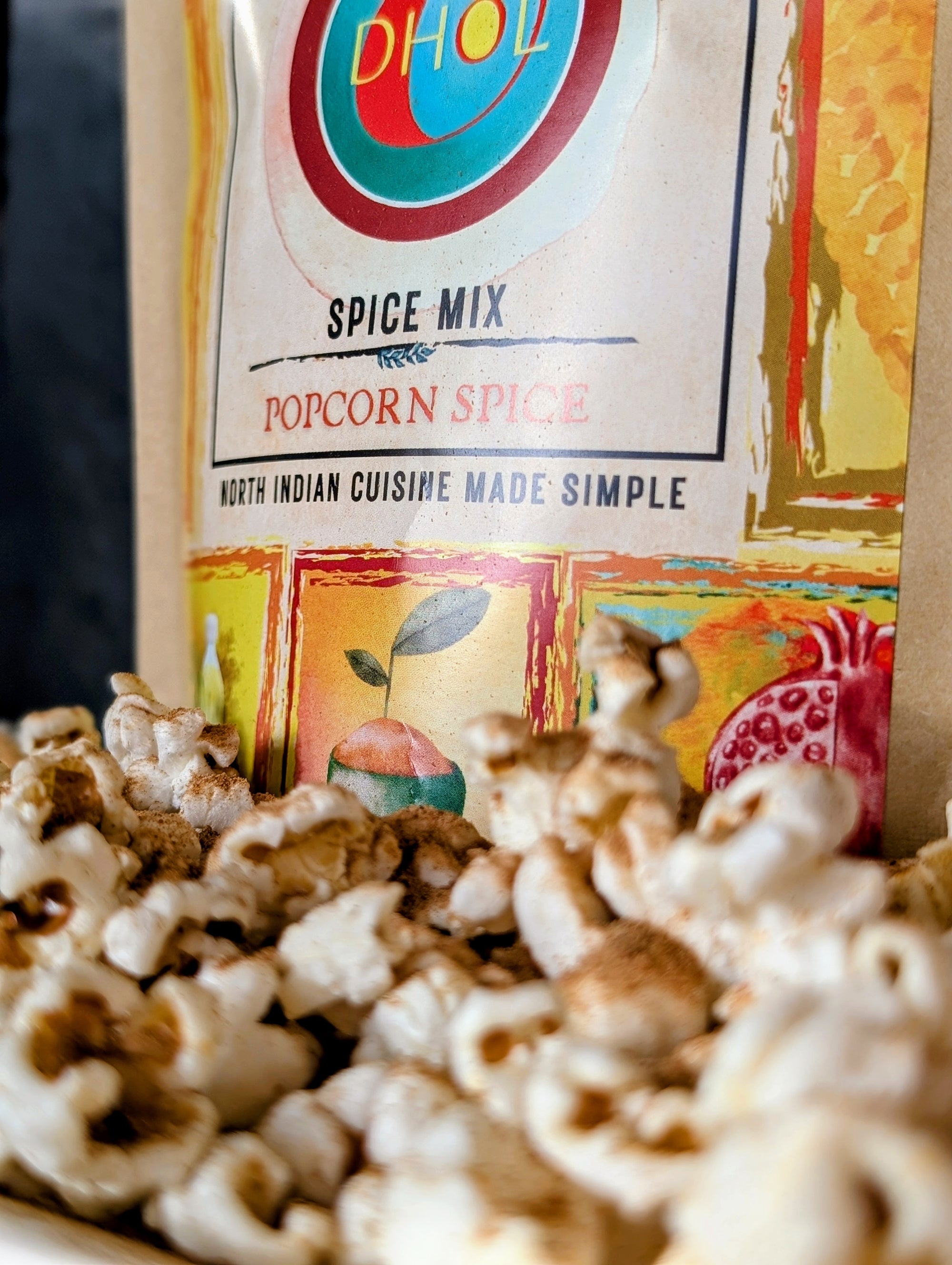 Popcorn seasoned with DHOL Popcorn Spice for a bold Indian twist! Elevate your snack.