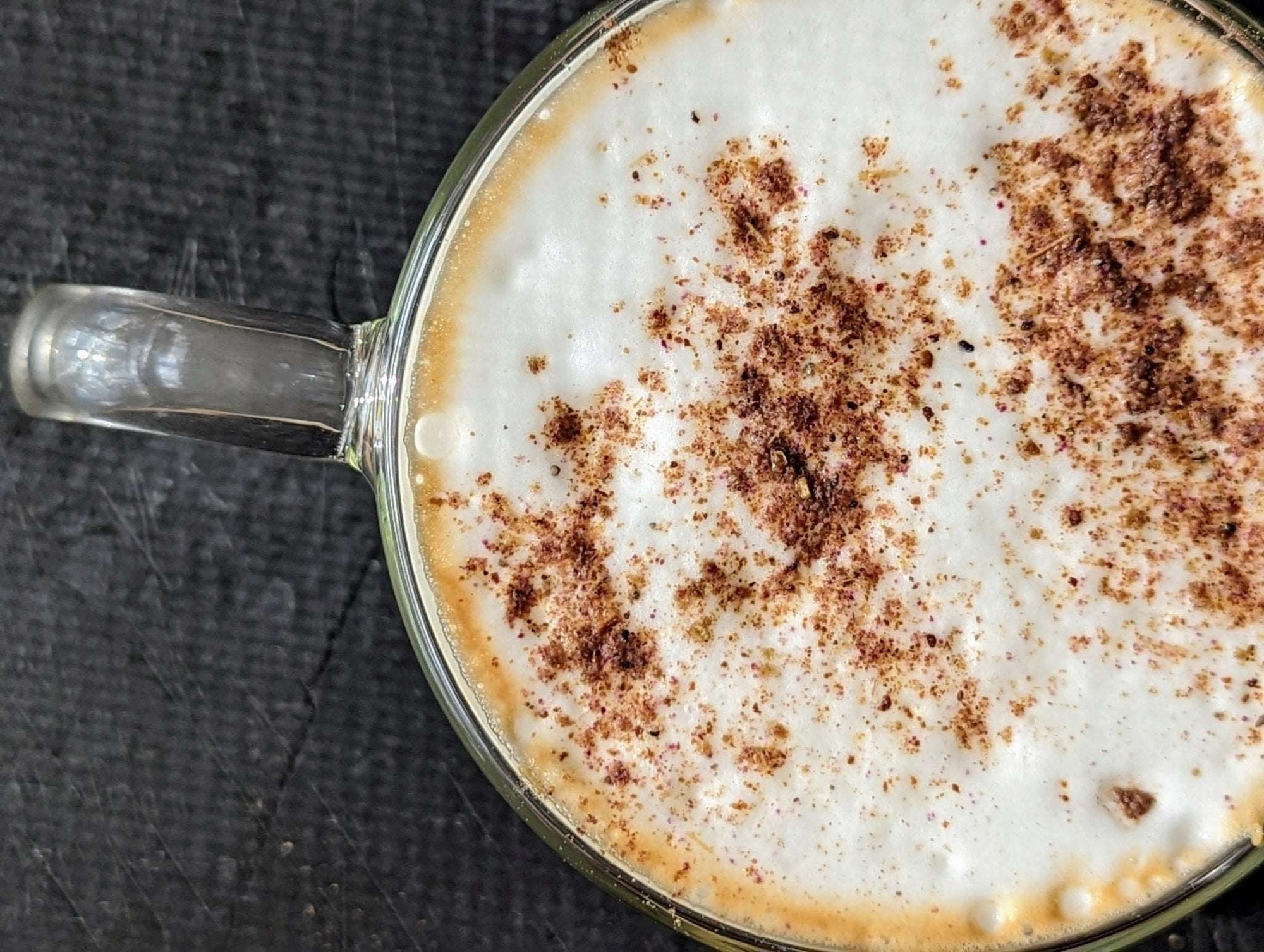 a pizza sitting on top of a metal pan