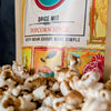 Popcorn seasoned with DHOL Popcorn Spice for a bold Indian twist! Elevate your snack. 