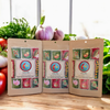 DHOL Spice Mix packs for Chana Saag, Shahi Paneer, and Chicken Curry, next to fresh vegetables. 