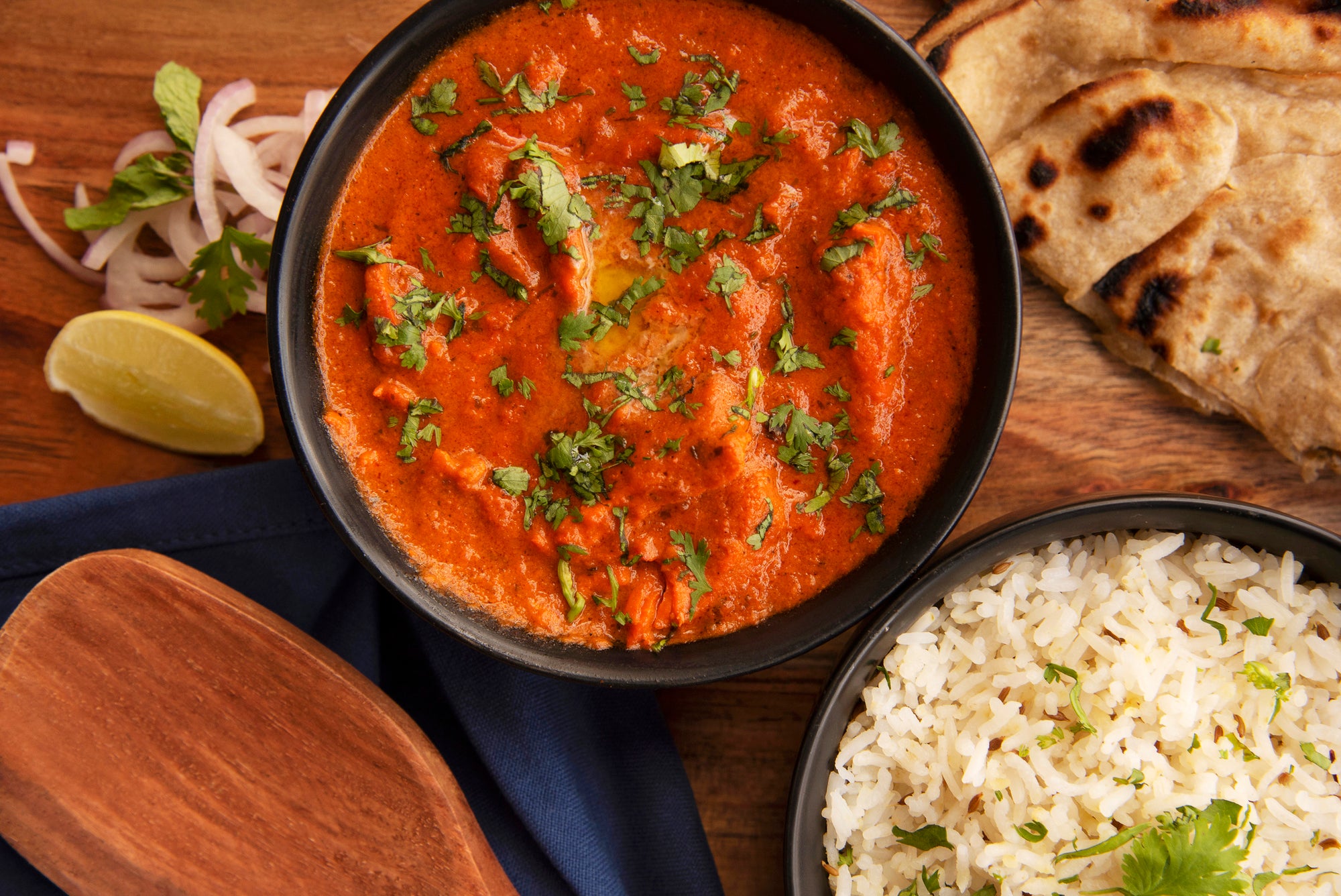 Rich and creamy buttery chicken curry served with fragrant basmati rice and freshly baked naan.