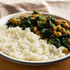 A plate of rustic Chana Saag with basmati rice made with DHOL Chana Saag mix