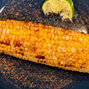 Sprinkle DHOL Popcorn spice on grilled corn for a flavorful summer treat