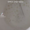 making a delicious, warm chai latte with dhol chai spice